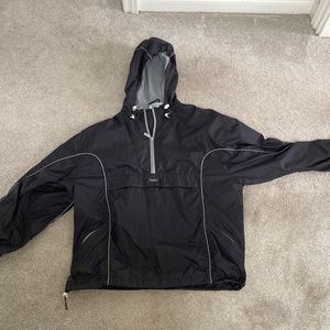 Vintage Reebok raincoat/shell. Adjustable waistband and hood. Velcro pocket.